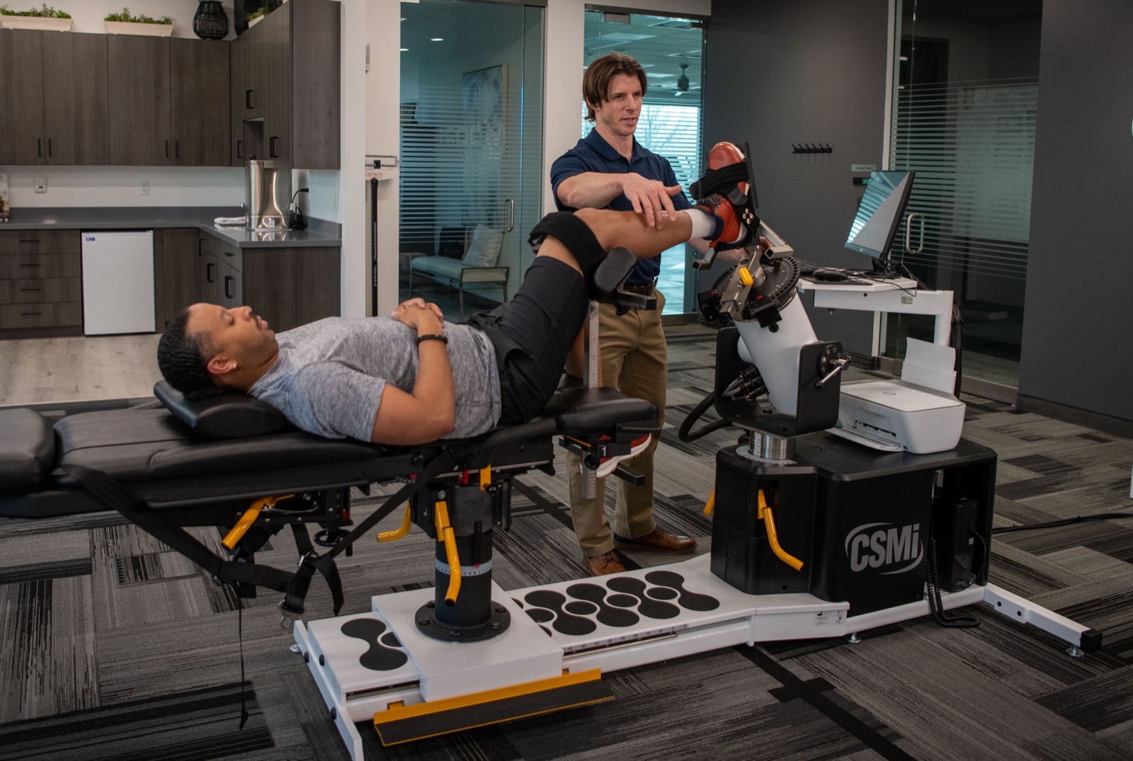 Physiomed Australia clinician working with patient